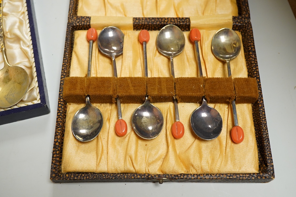 An Edwardian silver elliptical shaped inkstand, with two mounted glass wells and central pen wipe, James Dixon & Sons, Sheffield, 1906, together with ten Danish sterling and polychrome enamel spoons(a.f) and a cased set